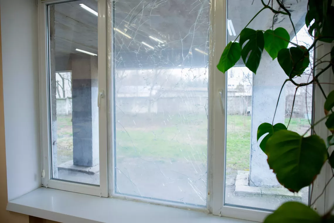 Damaged windows of an Odessa lyceum: anti-shatter film provided by UNICEF held the glass in place and prevented possible injuries.