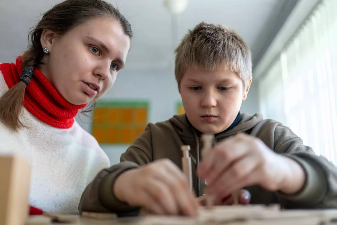 Vanya (9) during correctional classes with speech therapist Tetiana