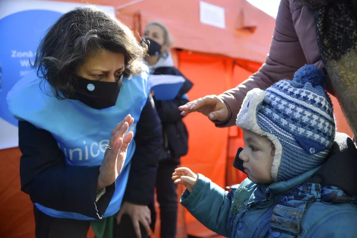 Romania. UNICEF UNICEF Regional Director for Europe and Central Asia Afshan Khan talks to a child.