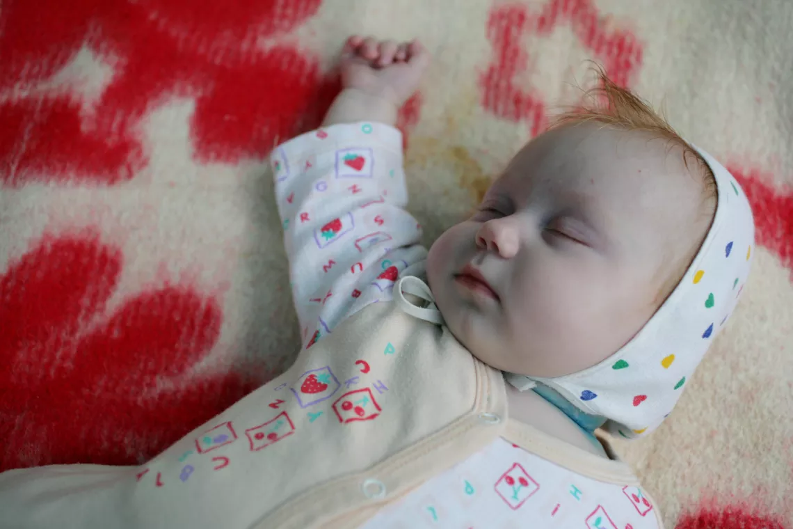 Red-haired baby sleeping