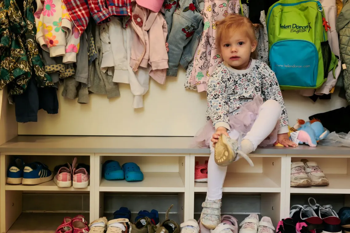 A toddler in a kindergarten.
