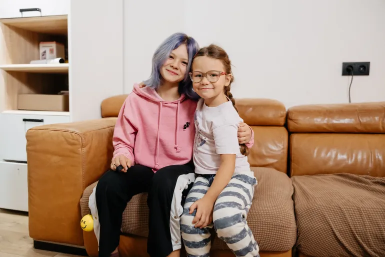 Siblings in their home in Ukraine