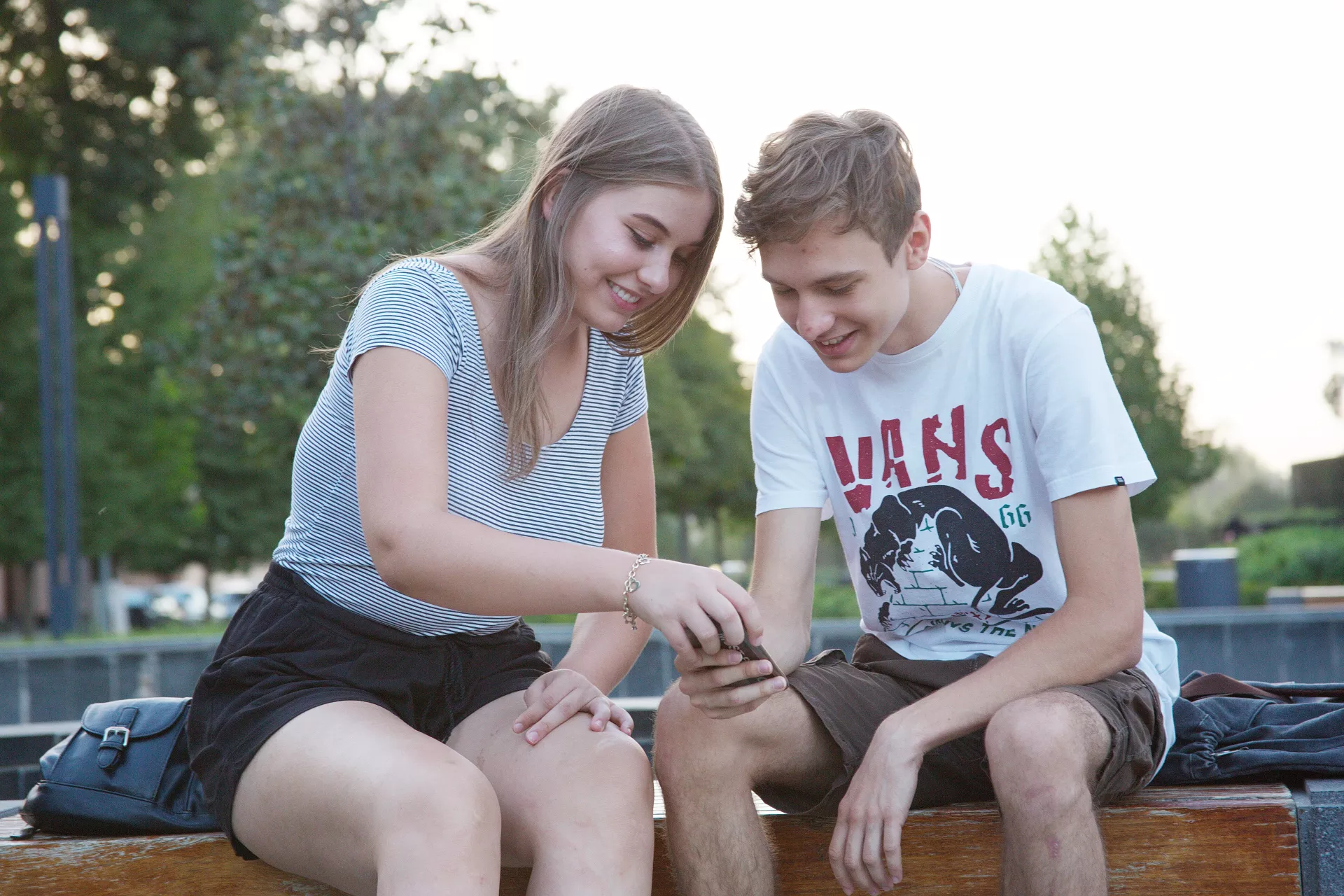 adolescents are discussing something they see on phone