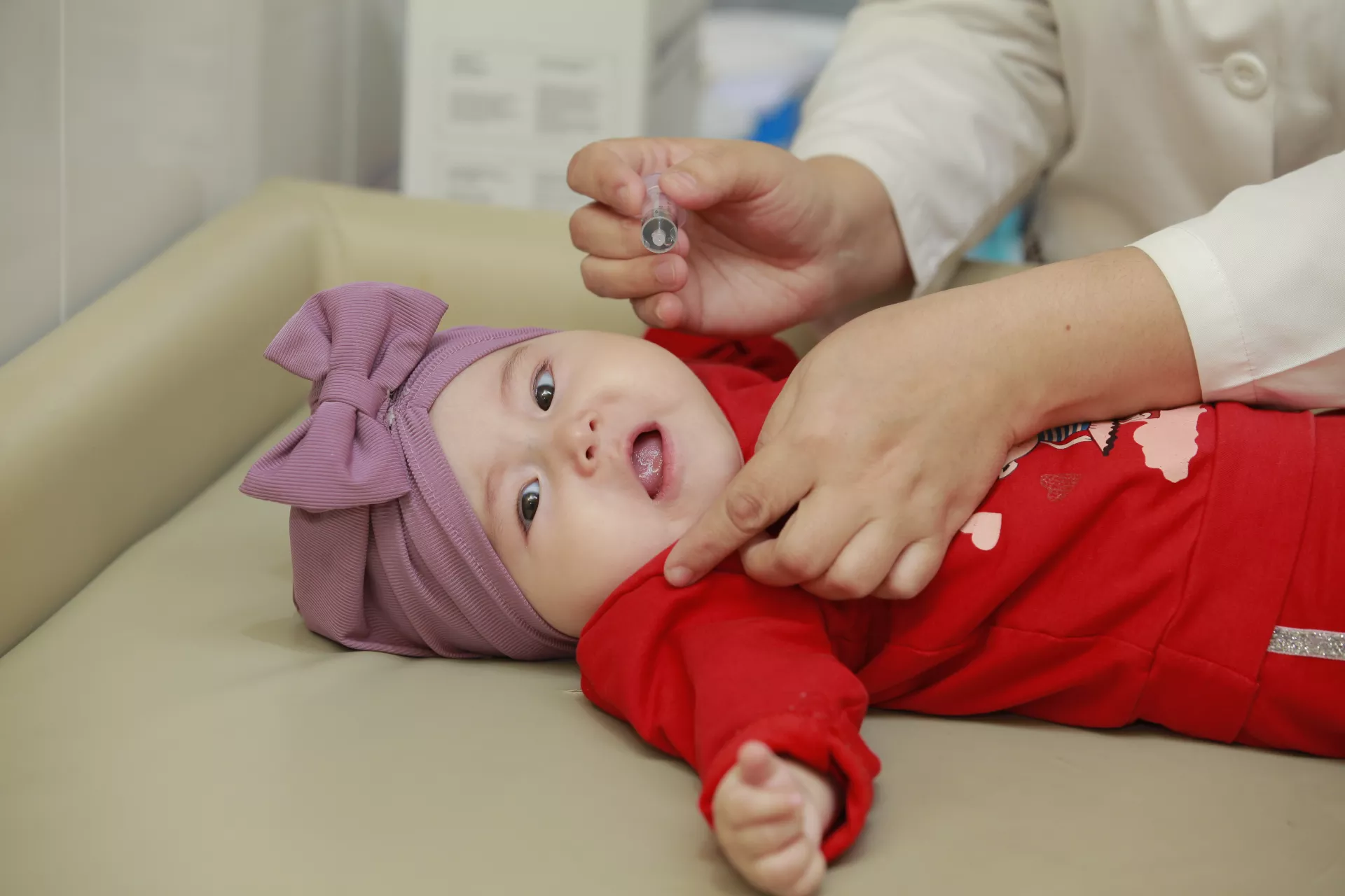 Little girl in immunisation room in Tashkent
