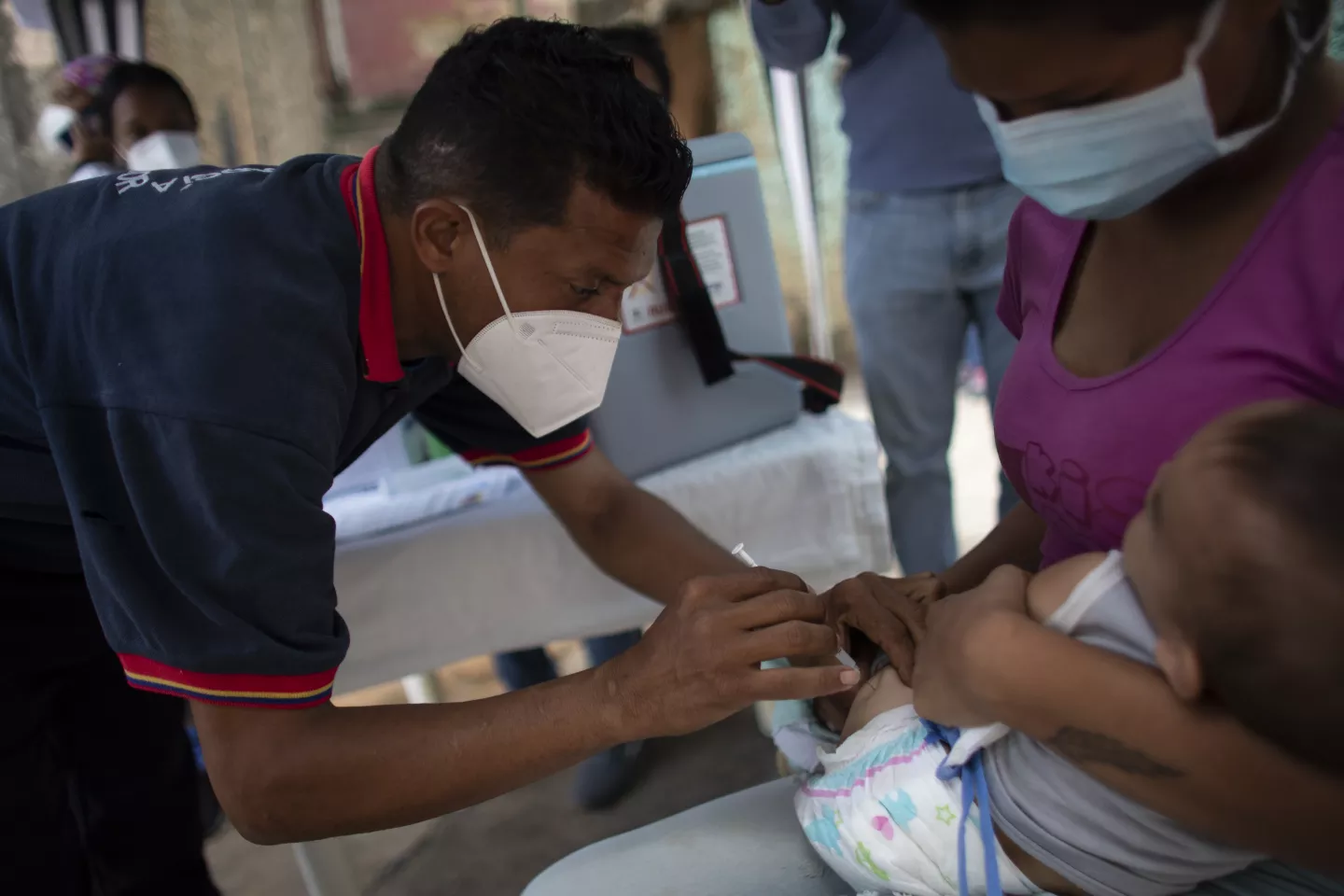 A 9-month-old boy is vaccinated during a UNICEF-supported mass vaccination drive.