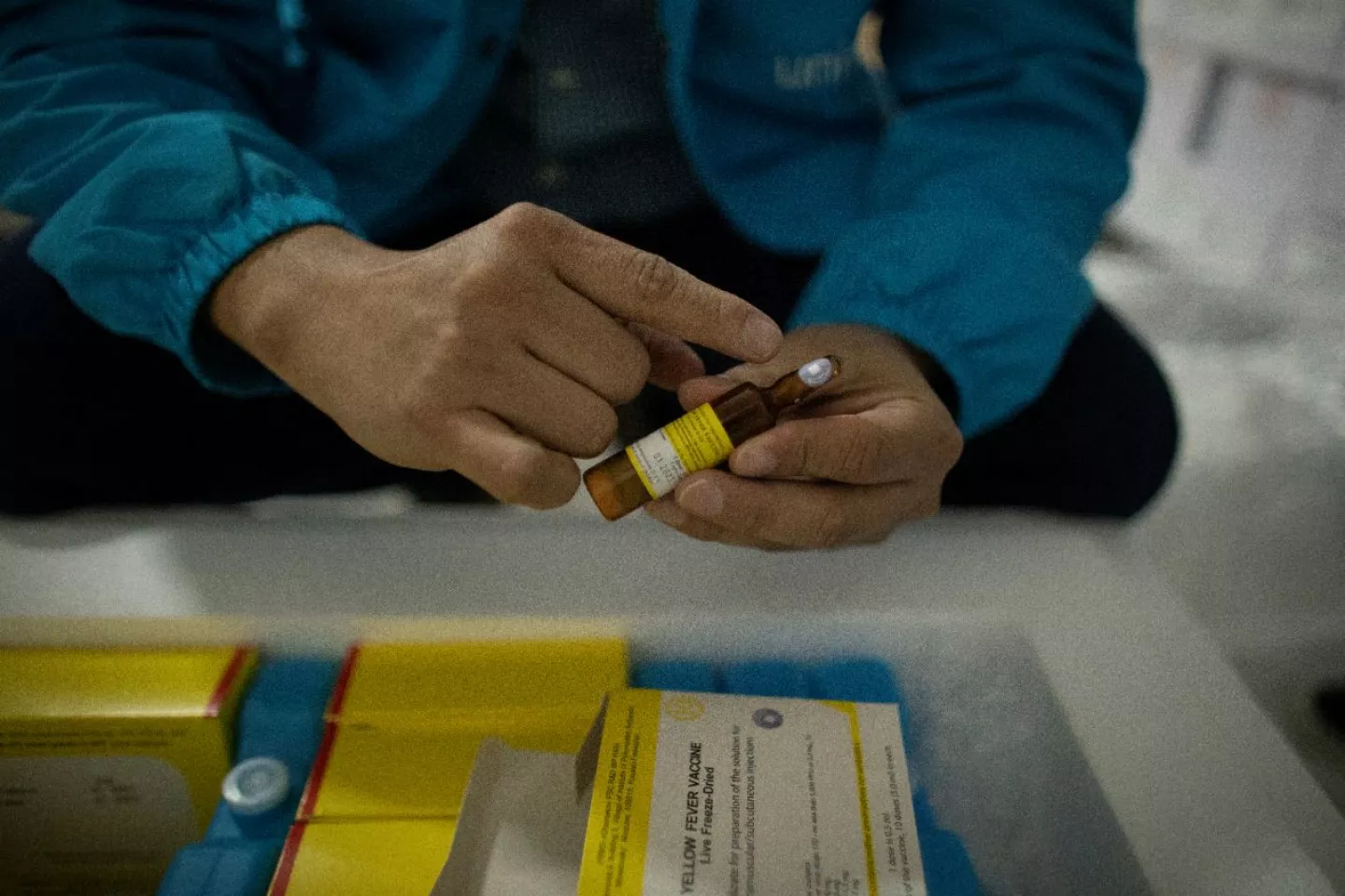 The UNICEF Venezuela Immunization Specialist, Melvin Mora, checks the vaccine monitor device to make sure it was kept at optimal levels during its transfer.