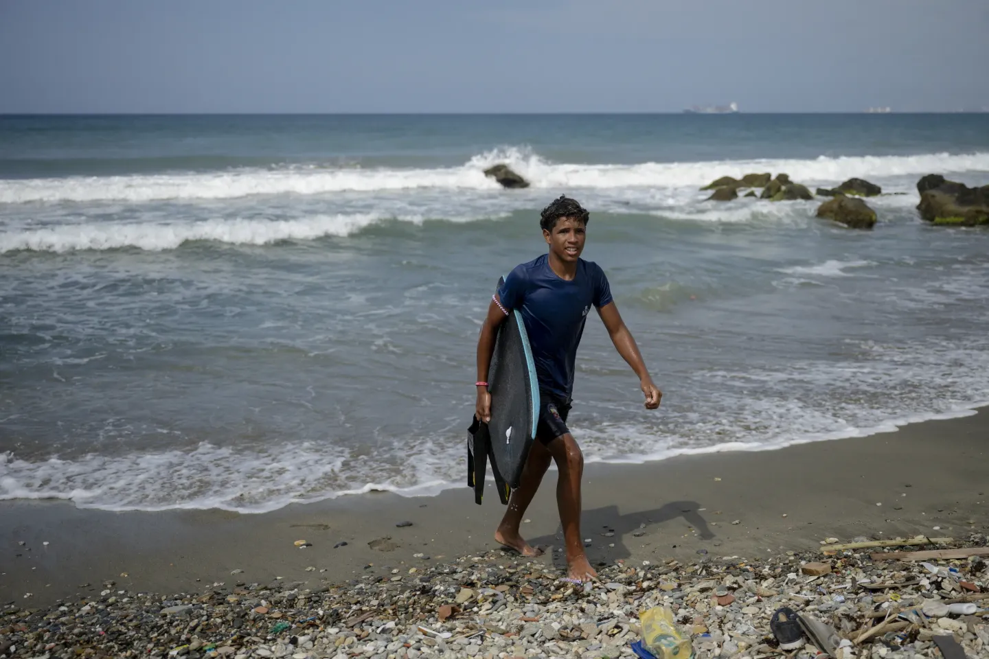 Jos&eacute; &Aacute;ngel practises bodyboarding off the coast of La Guaira, maintaining a routine that helps him feel calm.