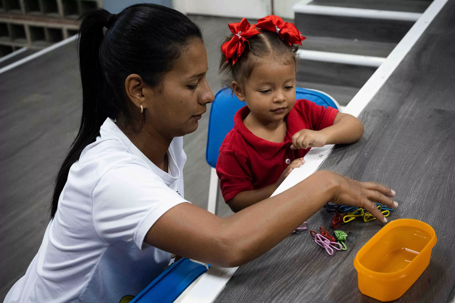A girl and her mother during the practical activities of the Care for Child Development programme supported by UNICEF in the San Agust&iacute;n community in Caracas, Venezuela, on 14 March 2023.