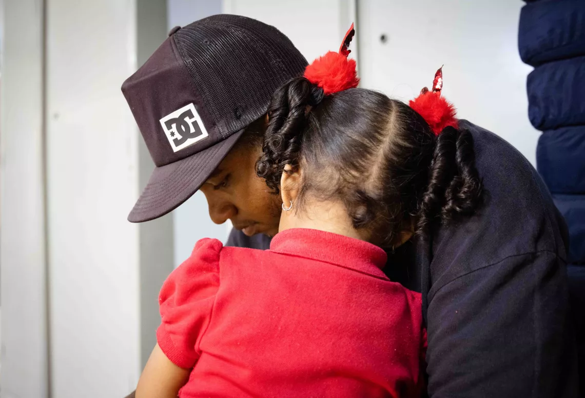 A girl and her father, during the practical activities of the Care for Child Development. San Agustin community, Caracas, Venezuela 14 March 2023.