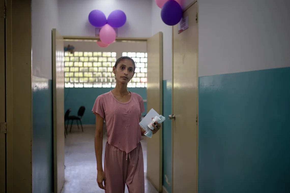 Elys Rodr&iacute;guez, 31, stands in the doorway of the health centre after receiving care during a UNICEF-supported community outreach session in Santa Luc&iacute;a del Tuy, Miranda State, Venezuela.
