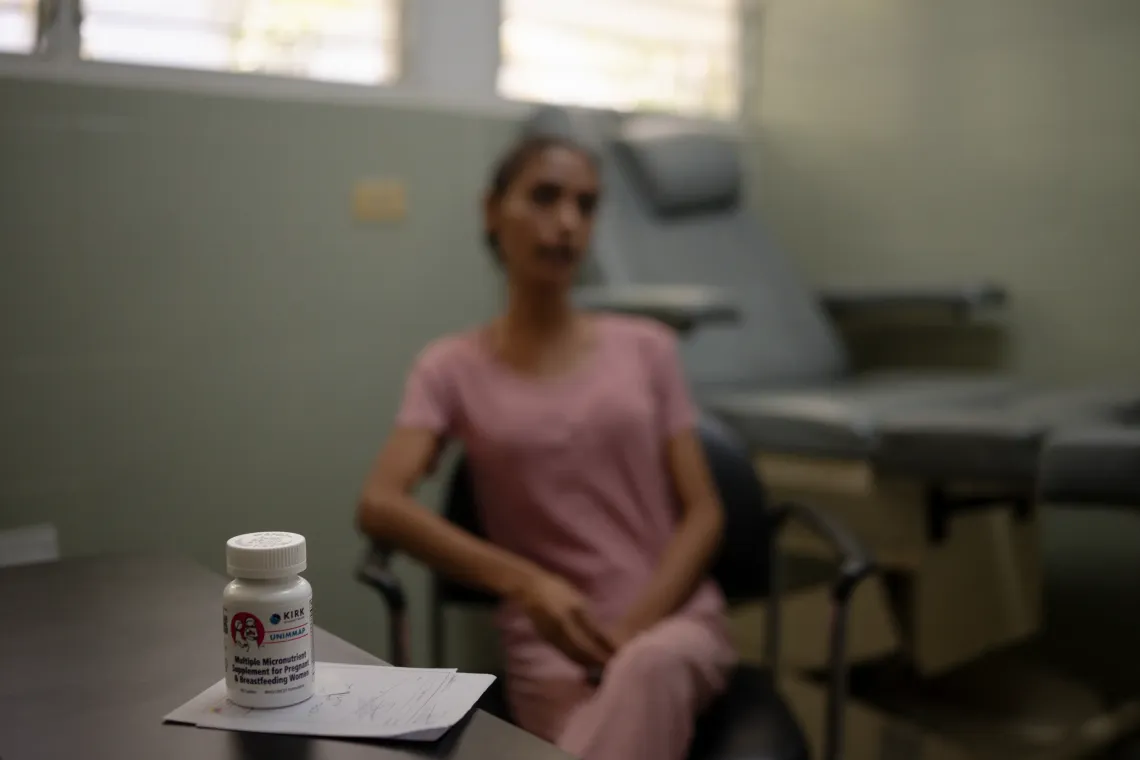 A bottle of micronutrient supplements sits on a desk as Elys Rodr&iacute;guez, 31, receives care during an antenatal consultation in Santa Luc&iacute;a del Tuy, Miranda State, Venezuela.