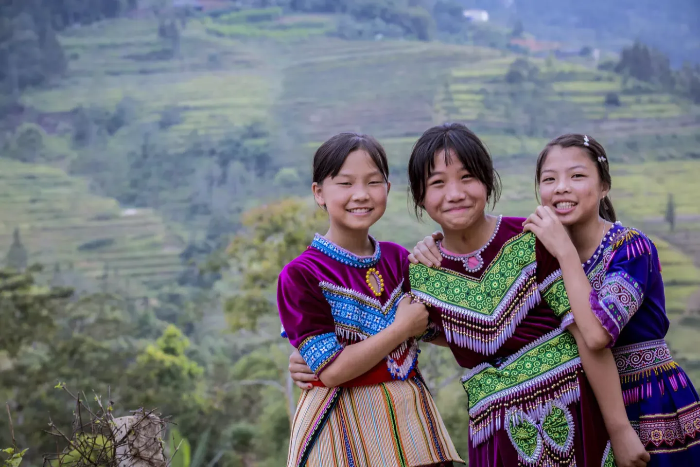 Three ethnic minority girls laughing 