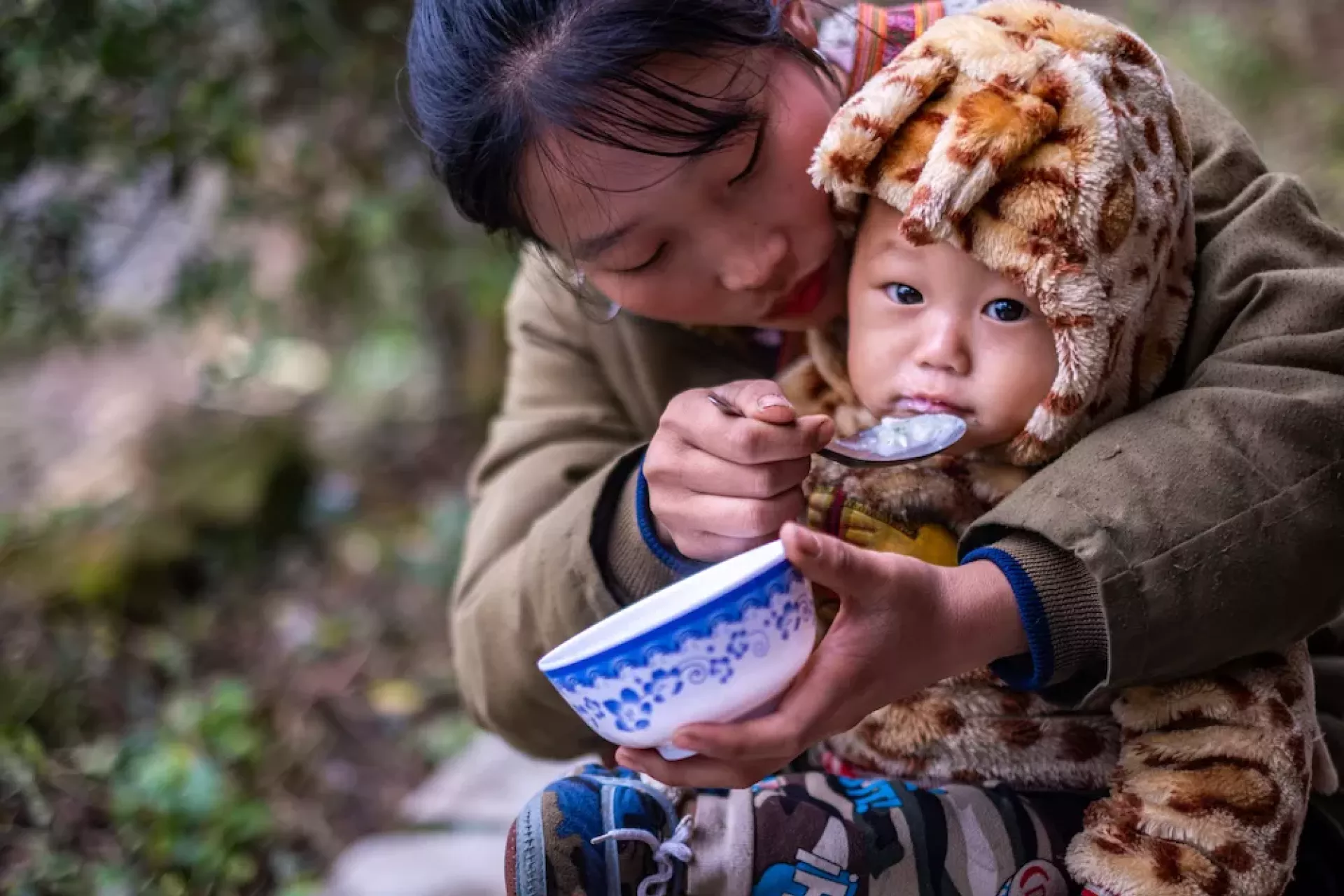 Mother feeding her child