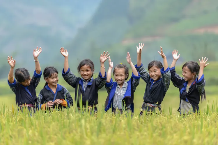 A group of ethnic girls in the rural areas of Viet Nam singing and dancing in the rice terraces area in their neighborhood at Mu Cang Chai, Yen Bai, Viet Nam.