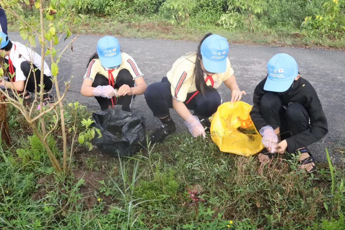  Students participate in tree planting in a school area