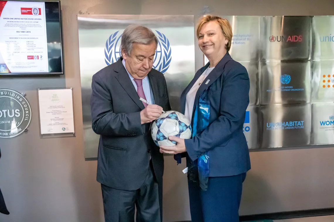 UNICEF Viet Nam Representative Rana Flowers getting a football signed by UN Secretary-General Ant&oacute;nio Guterres at GOUNH, Ha Noi, Oct 2022