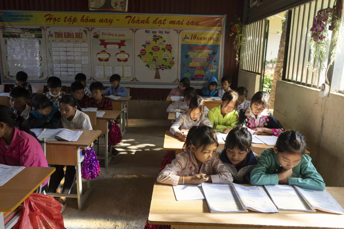 Ly Thi Luon (right, second row), 11, attends class at Ta Te Elementary School, Dien Bien, Viet Nam.
