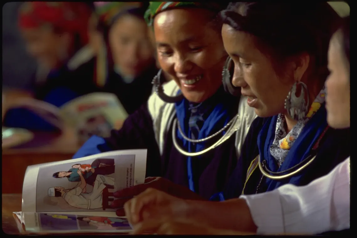 Women from the H'mong ethnic group learn essential child health, gender, and development information during a UNICEF-assisted training session at a Women's Union centre in northern Yen Bai province (now Lao Cai province). These knowledge-sharing sessions were brought to life by Facts for Life, a United Nations inter-agency booklet. By the mid-1990s, over 100,000 Vietnamese women and girls owned a copy. 