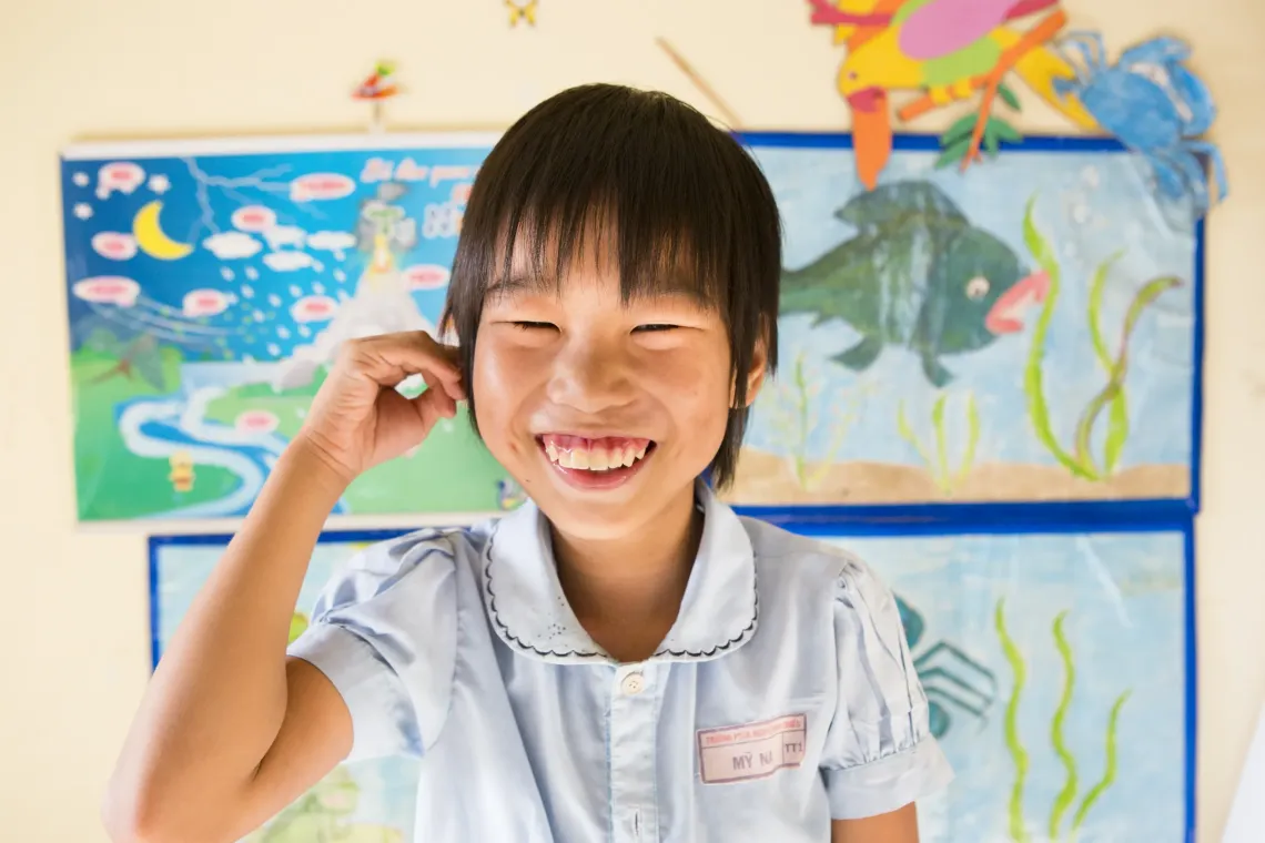 Bui My Na attends class with a smile on her face at the Nguyen Dinh Chieu Special School in Da Nang.