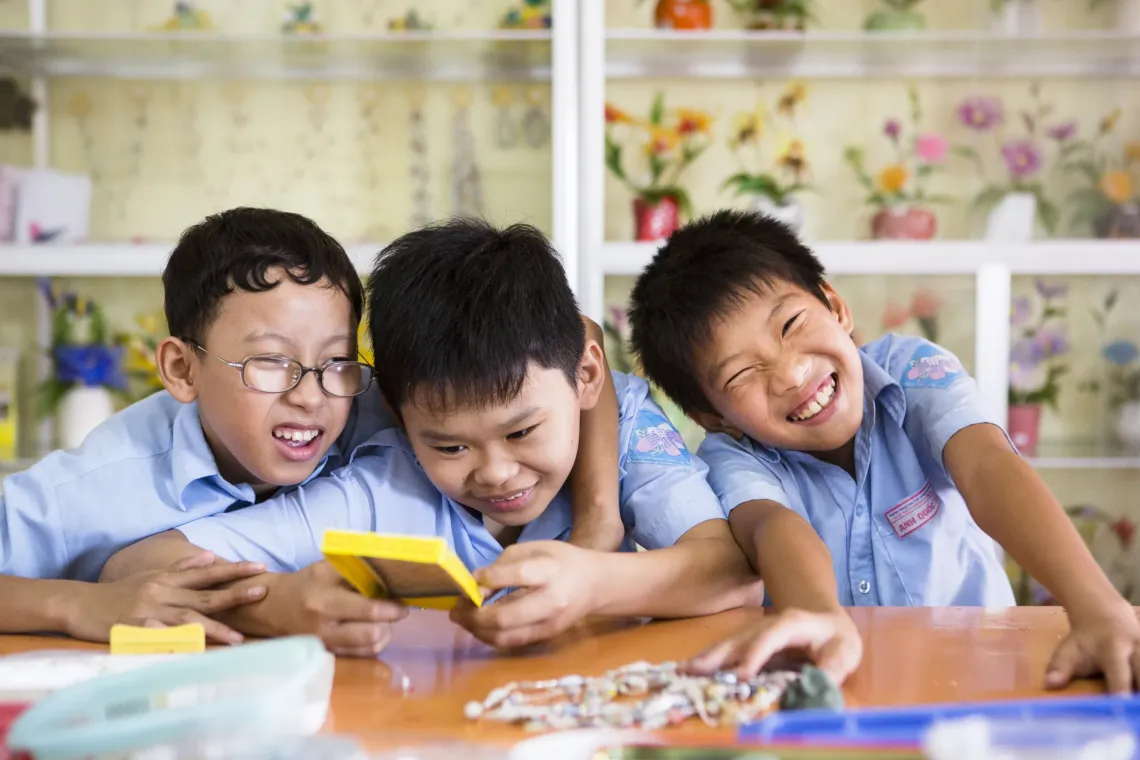 Nguyen Trung Nghia (left), Nguyen Da Hoa (centre) and Trinh Anh Quoc attend a vocational class making necklaces at Nguyen Dinh Chieu Special School in Danang.