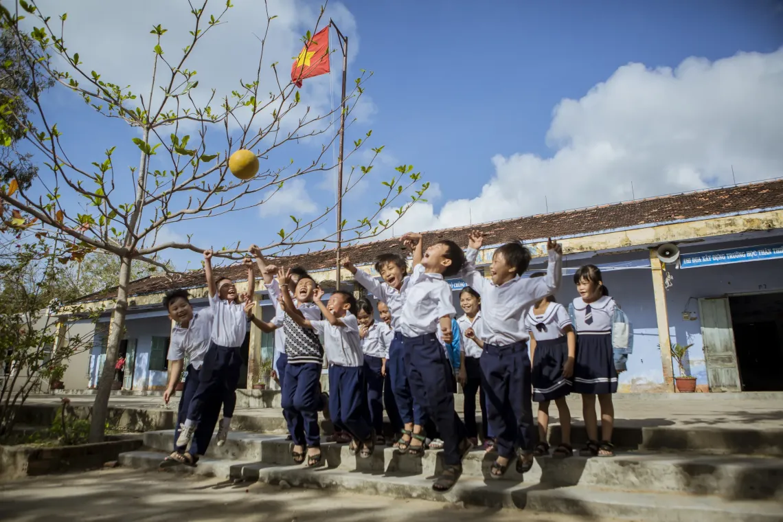 Children play with a ball at Vinh Hy Primary School, Ninh Thuan Province (now Khanh Hoa province)
