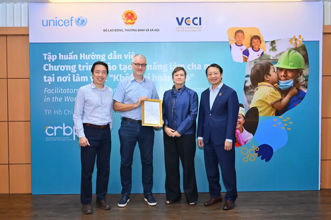 Representatives from MOLISA, VCCI and UNICEF with senior manager of participating company demonstrating commitment to the program