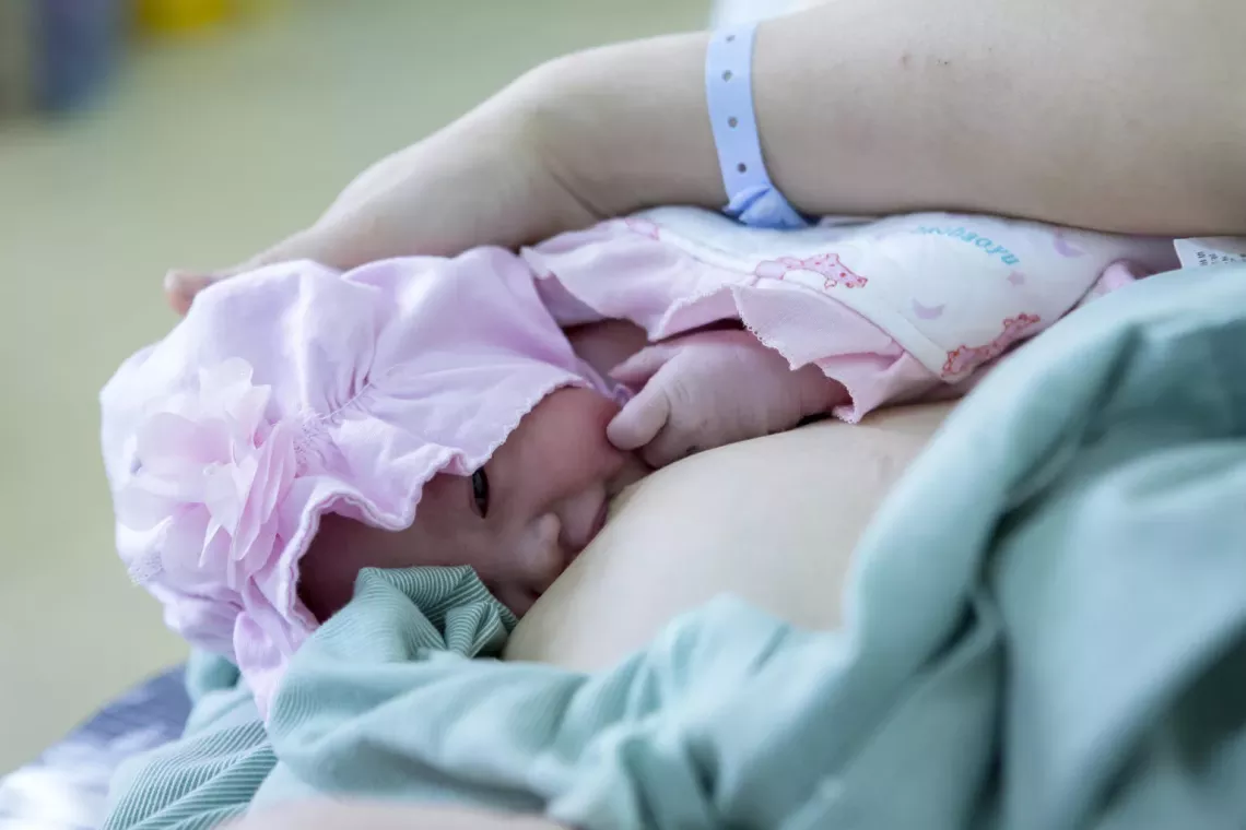 Infant breastfed by her mother