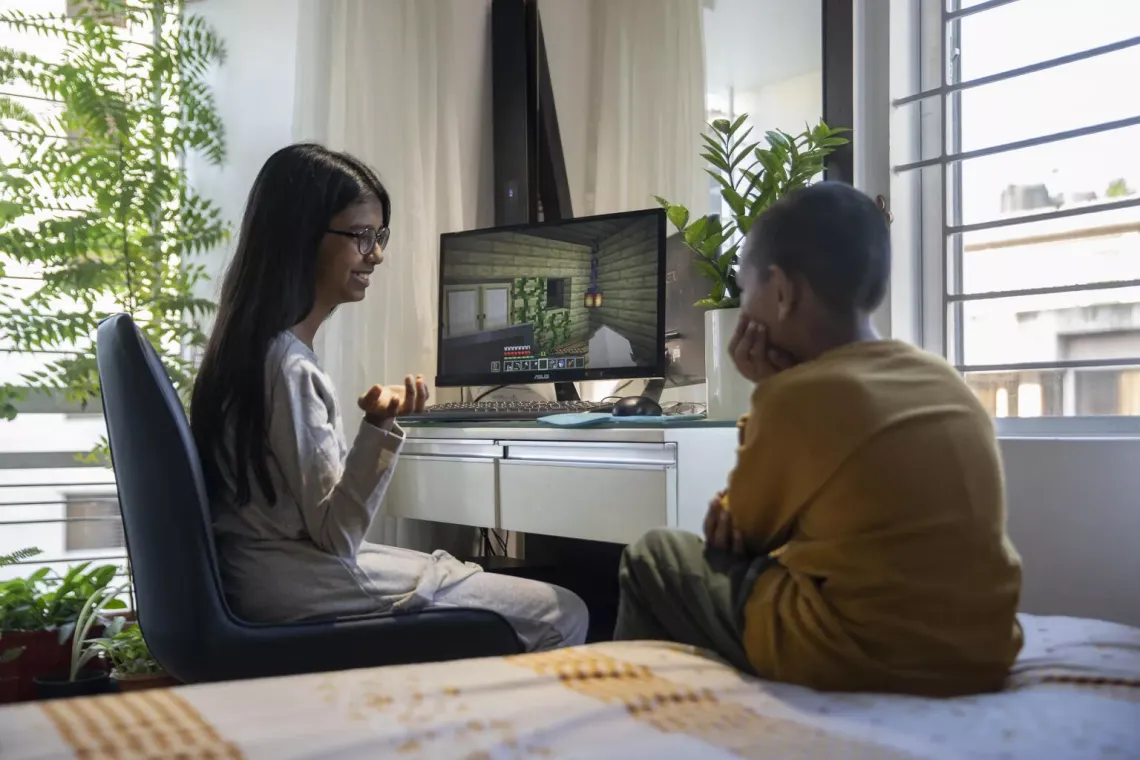 Video games explained: A sister plays a game with her brother