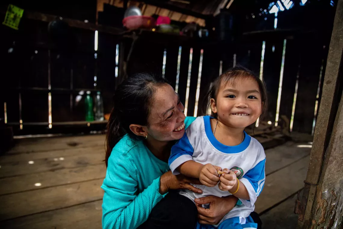 L&yacute; Th&ugrave;y Trang, 3, cooks lunch with her mother, Tay, 32, Ba Na ethnicity at home in KretKot village, H&rsquo;ra commune, Mang Yang district, Gia Lai province on 9 January 2024.