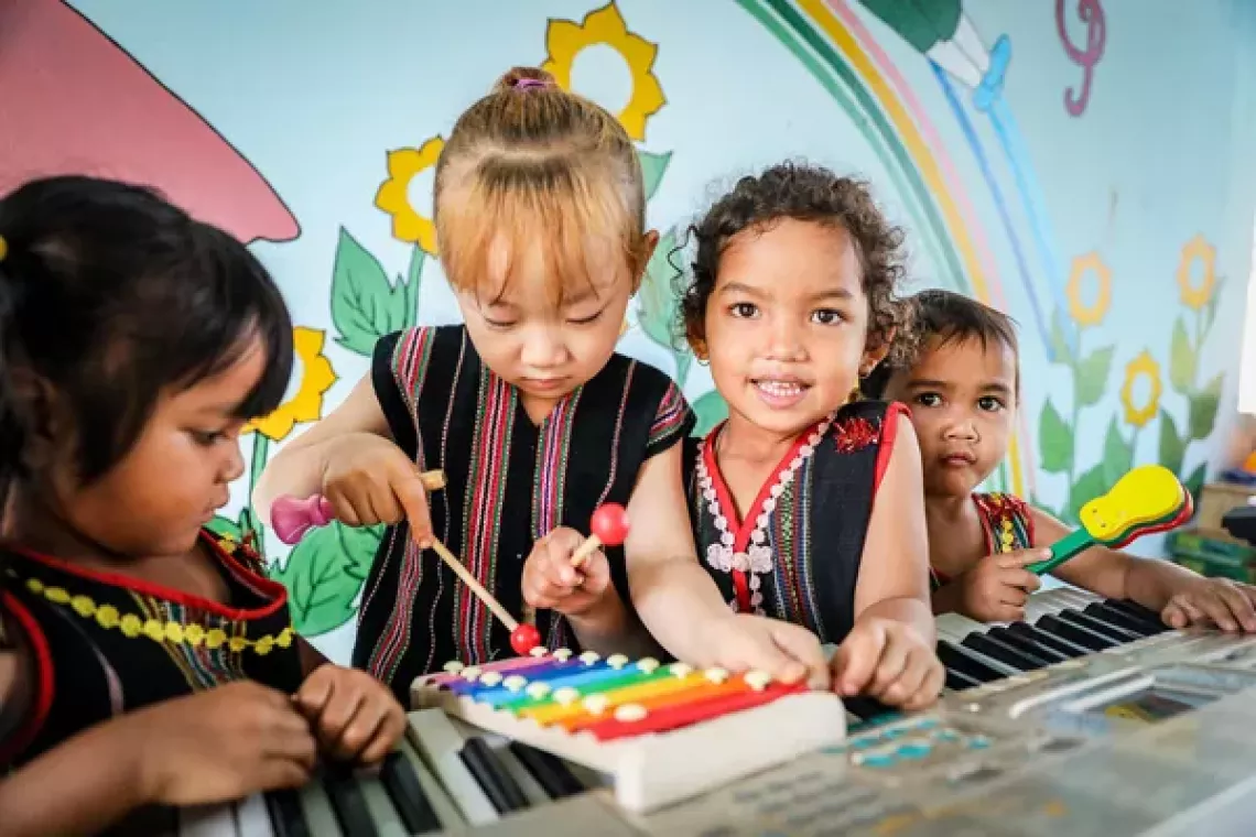 On 9 April 2024, students at Lo Pang preschool, Mang Yang district, Gia Lai province play with musical instruments in the school&rsquo;s community-based library.