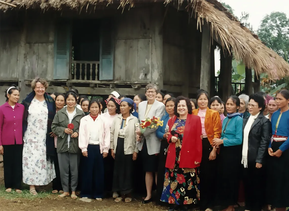 At the time, UNICEF Executive Director, Carol Bellamy (centre, wearing a grey jacket), UNICEF Viet Nam Representative, Rima Salah (fifth from the right, in a red jacket), Madame Tran Thi Thanh Thanh, Chairwoman of the Viet Nam Committee for Children&rsquo;s Protection and Care (second from the right, wearing a black jacket), and Elaine Furniss, Chief of Education (second left in white dress) during a visit to ethnic communities in Yen Bai province (now Lao Cai province) in 1995. 
