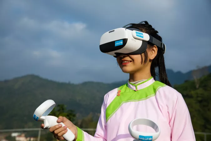Mong Quynh Chi 14 years old, tries the AVR technology by the headset and equipment supported by UNICEF at Bat Xat secondary high school in Lao Cai, Viet Nam.