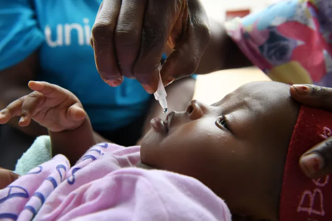 A baby receives a polio vaccine at a health center in Kinshasa, in the Democratic Republic of Congo.