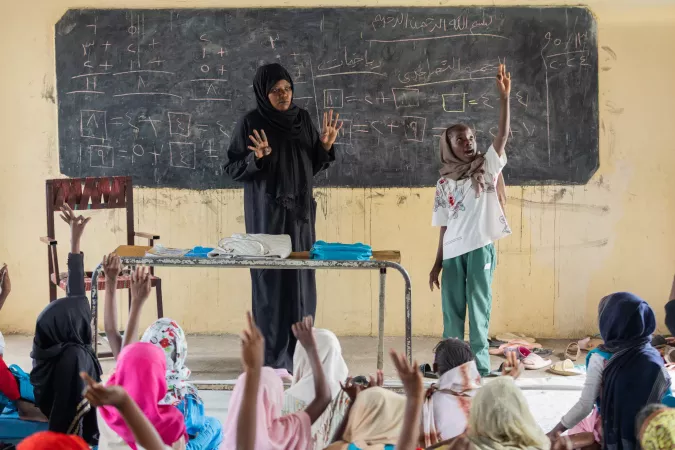 Standing at the front of the class, at the UNICEF-supported safe learning space in October North school in Gedaref state, 11-year-old Rabha counts from one to ten in English as the rest of the class repeats after her.
