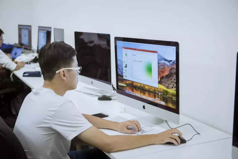 A young man using a computer