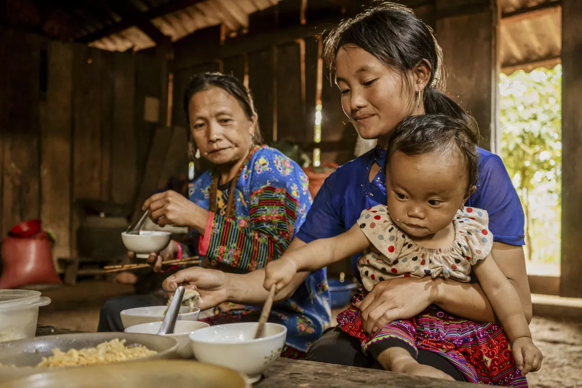 Hang Thi Yeu enjoys lunch with her mother and grandmother at home.