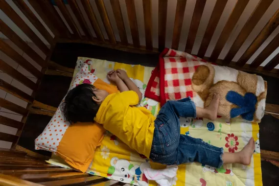 A child lying in bed