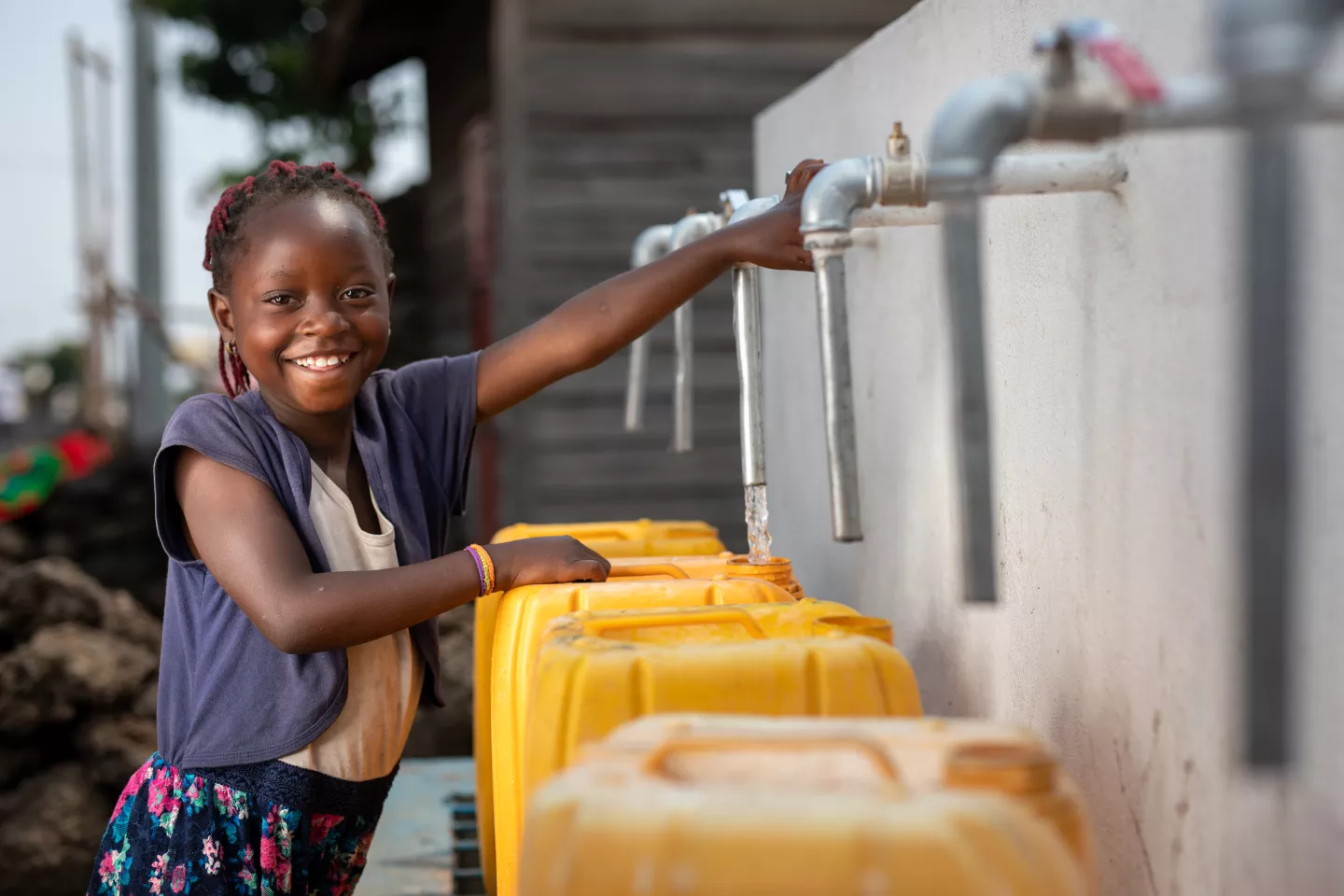 Marie, draws water from a standpipe built with the support of UNICEF in the Buhene district of Goma, capital of North Kivu province, to the east.