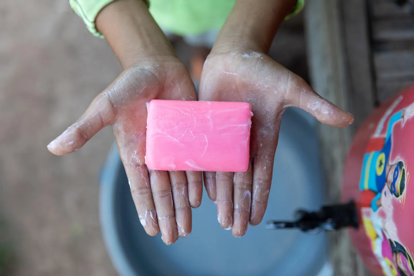 Panha&rsquo;s friend washes his hands with soap acquired via UNICEF&rsquo;s Water and Sanitation programme, in collaboration with the Ministry for Rural Development (MRD), and with funding from the Irish Aid.