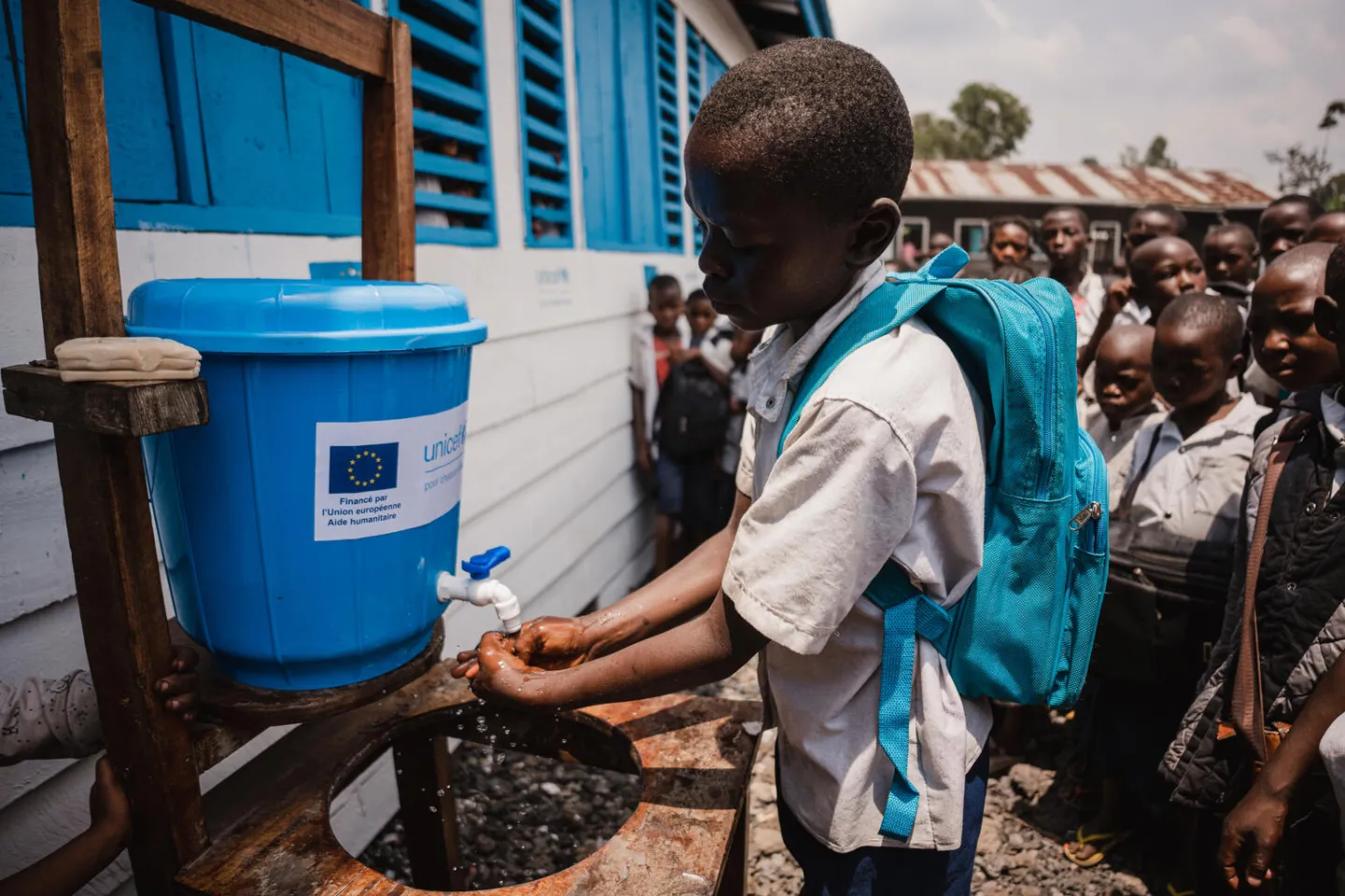 A pupil demonstrates proper hand-washing in front of his classmates at Saint-Jean primary school, located near the Rusayo site for displaced people, in North Kivu province, DR Congo.