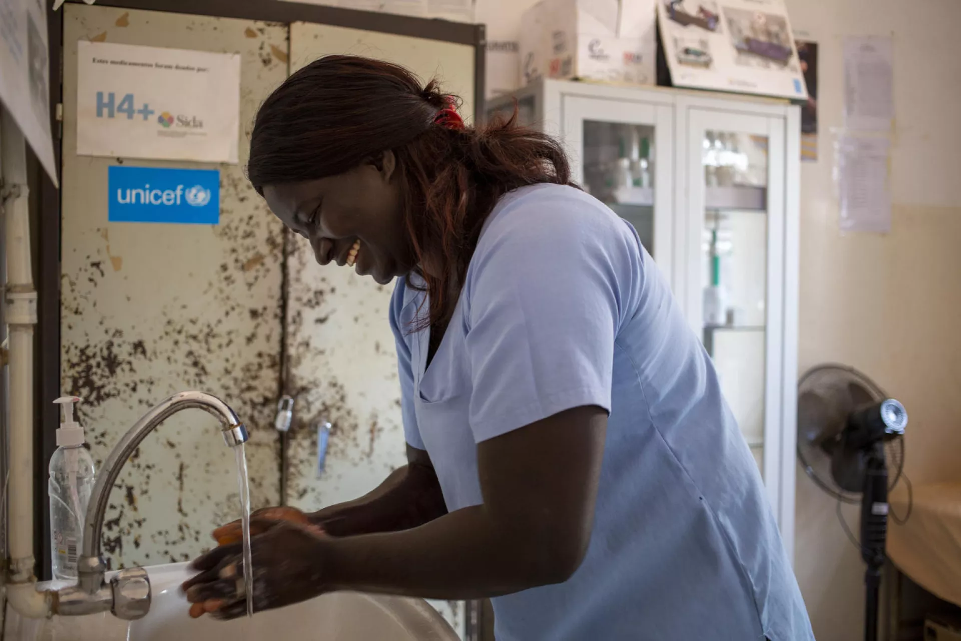 Nurse Murida Co ( 34) wash her hands inside the clinic in the remote village of &nbsp;Dara , Guinea Bissau