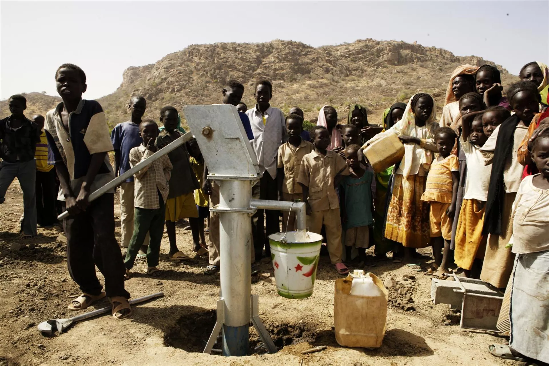 Community members try out a new UNICEF-provided Mark II/III handpump in the village of Lajok in South Kordofan State in Southern Sudan. 