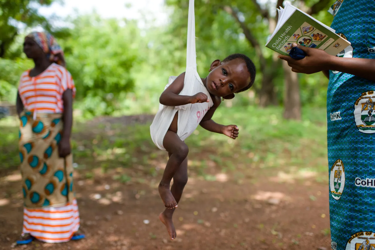 Hajara Abdul Rahman being weighed at a clinic in Tamale