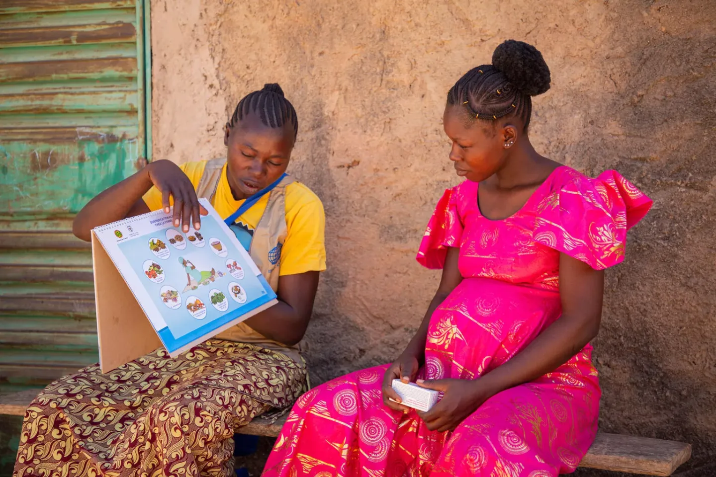 A pregnant woman receiving guidance and support to better her health during her pregnancy