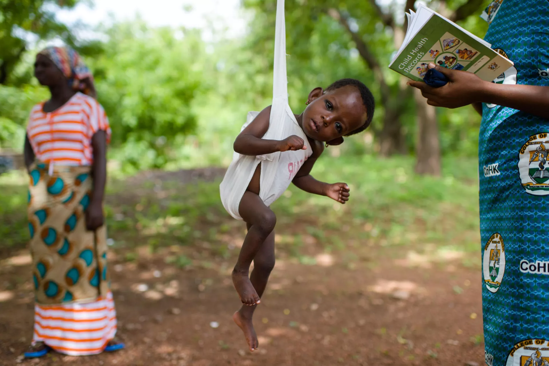 Hajara Abdul Rahman being weighed at a clinic in Tamale