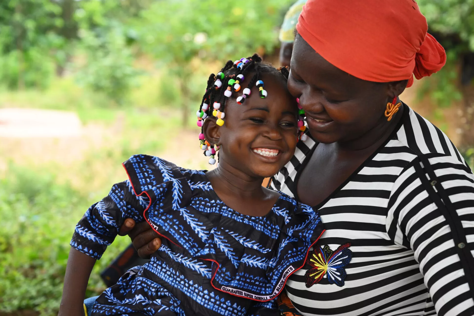 A mother and her daughter smiling