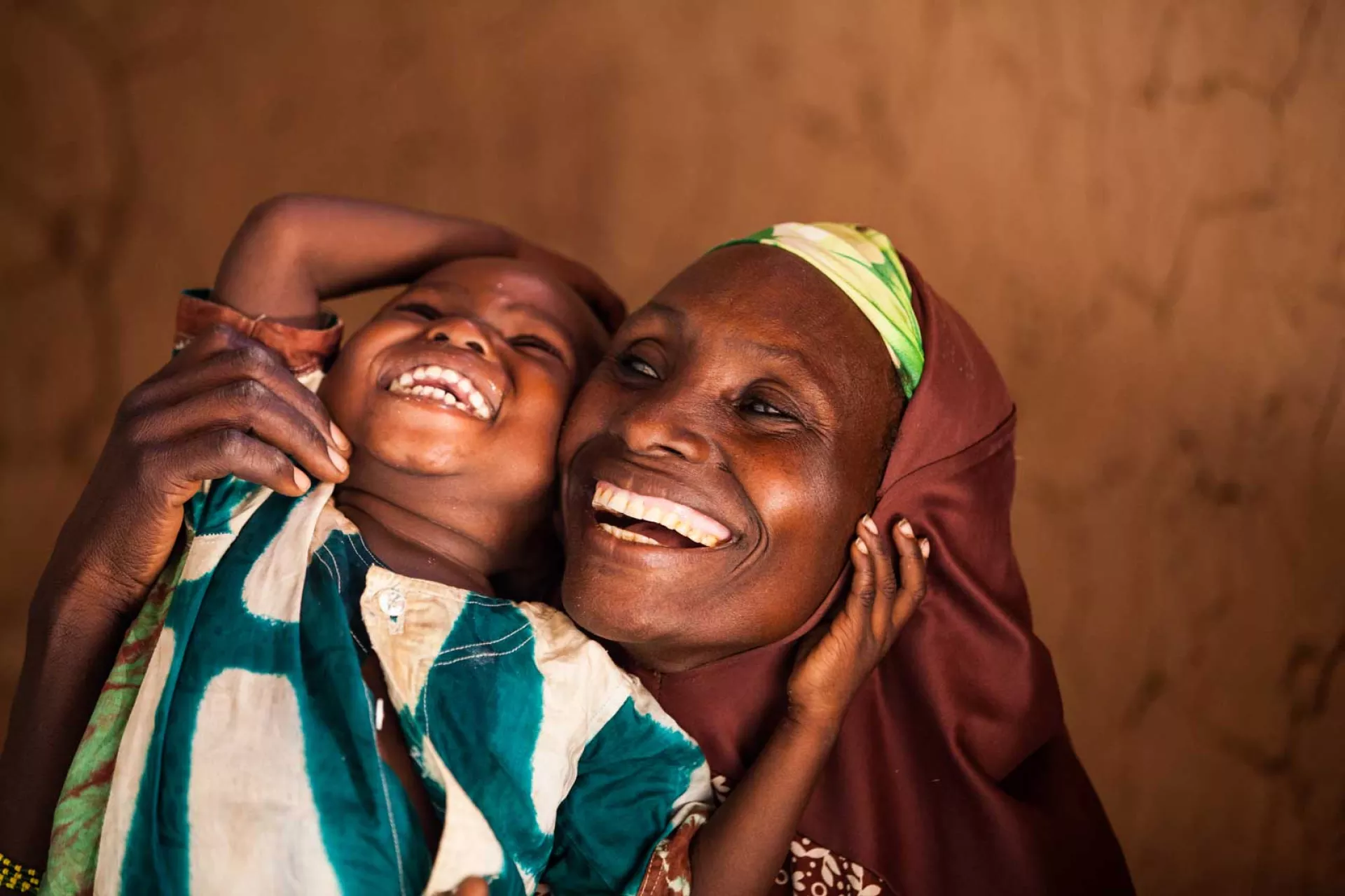 A mother and child laughing
