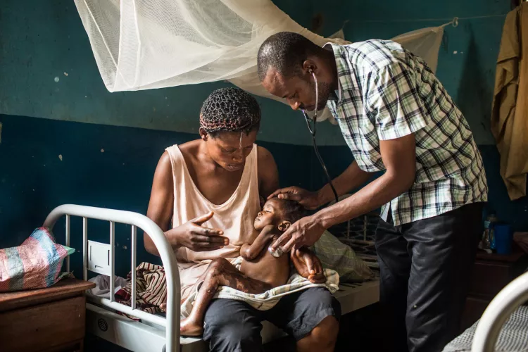 Dr. Elvis Badianga Kumbu examines baby Marie after his shift at the Presbyterian Hospital in Mbuji-Mayi, Kasa&iuml; region, Democratic Republic of the Congo, Friday 26 January 2018.