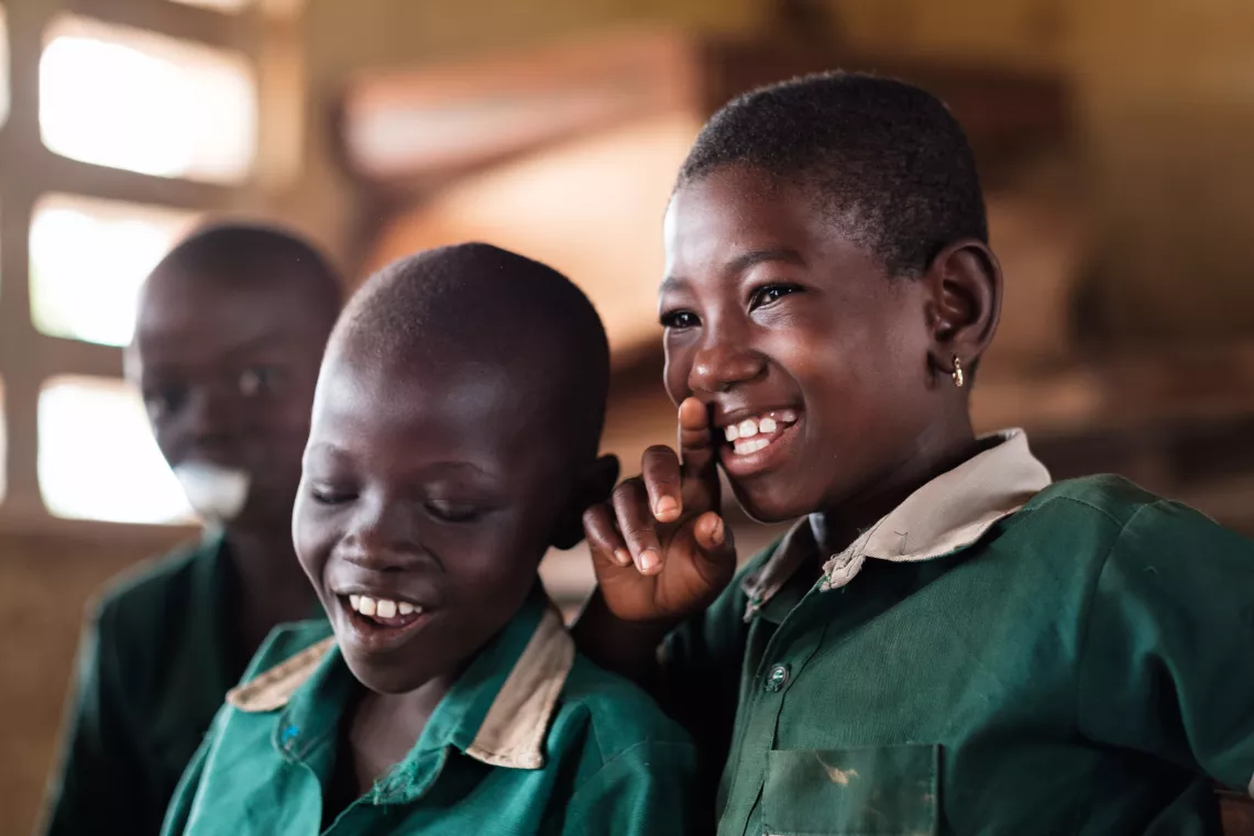 A boy and a girl laughing
