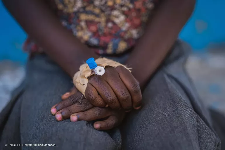 Close-up on the hands of a child who has recently received treatment